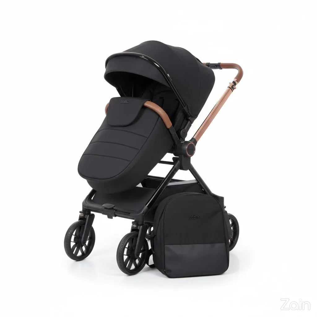 Black stroller with matching footmuff and bag on a white background