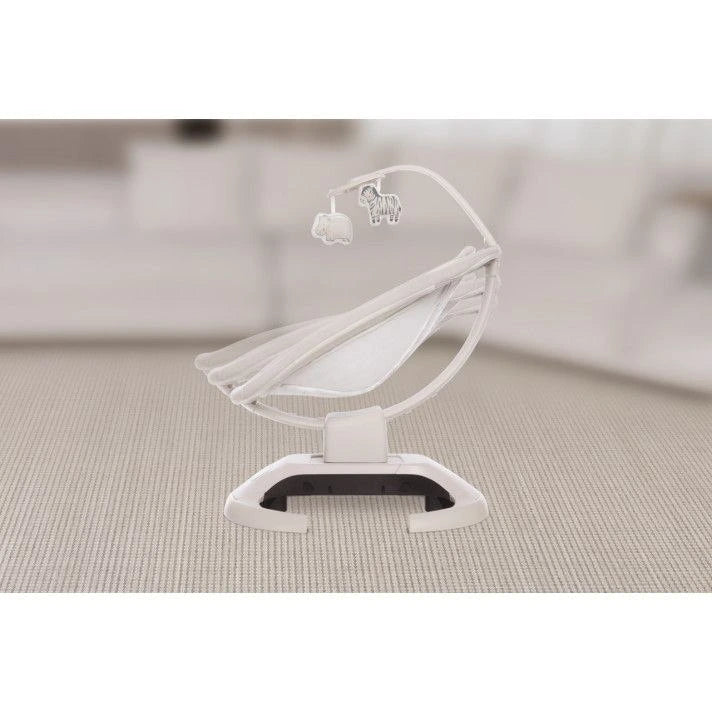 White baby crib toy on a neutral background